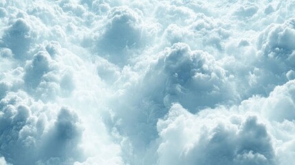 Obraz premium Fluffy white clouds in a bright blue sky creating a serene and dreamy outdoor nature background for panoramic wallpaper applications