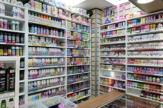 Electronic cigarette vape shop display with shelves of vibrantly colorful single use disposable vapes. Leeds, UK 01 11 2025 
