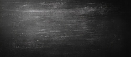 Black Chalkboard Texture Featuring Ample Empty Space Ideal for Text or Graphic Overlays in Educational and Creative Contexts