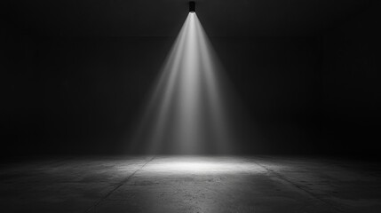 A pure black background with a single beam of light illuminating the center