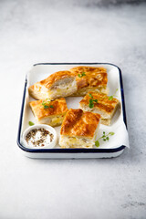 Savory potato pie with cheese and ham