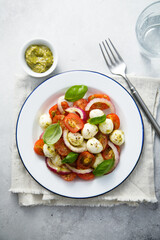 Tomato salad with red onion and cheese