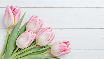 bouquet of tulips on wooden background