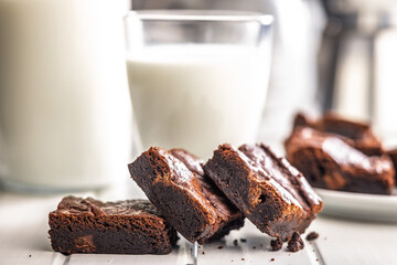 Homemade chocolate brownies on white table.