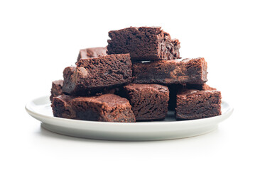 Homemade chocolate brownies on plate isolated on white background.