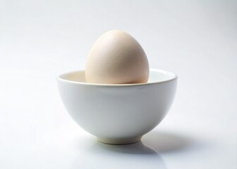 Single Egg in Minimalist White Bowl - Perfect for Breakfast Recipes & Food Blogs