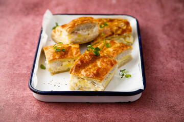 Savory potato pie with cheese and ham