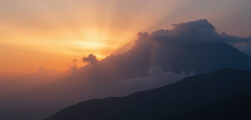 Majestic mountain at sunrise with soft rays