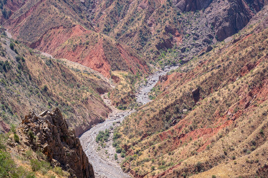 Scenic summer landscape view of colorful valley with red mountains and river bed, Khatlon, Tajikistan	
