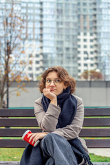 Fototapeta premium Portrait of a young woman in a big city. Woman in the city.