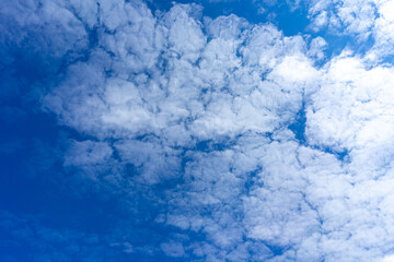 blue sky with cumulus clouds texture background