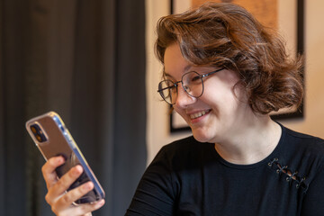 A beautiful happy young woman with a phone. Emotion concept.