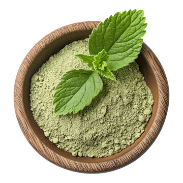 Lemon balm powder in a wood bowl isolated on a white background