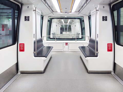 27-12-2024 Munich International Airport, Germany. Empty underground terminal transit shuttle train. Inside view, no people