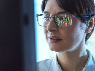 Financial Markets, City analyst viewing share performance of a company on the stock market