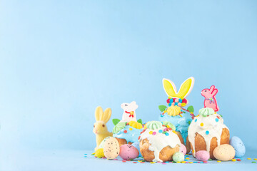 Bright colorful Easter cakes, pastries and eggs greeting card background