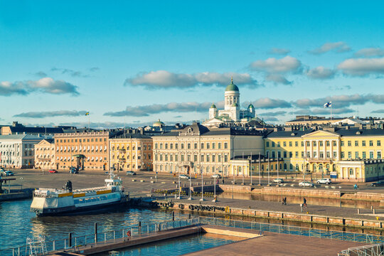 Sunny day view of Helsinki historic city center waterfront with classical European architecture and Helsinki cathedral in the background, Helsinki, Finland