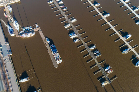 Aerial view of boats docked neatly in parallel rows at a marina, Helsinki, Finland