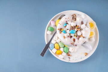 Easter hot chocolate with whipped cream, marshmallow and crushed chocolate eggs