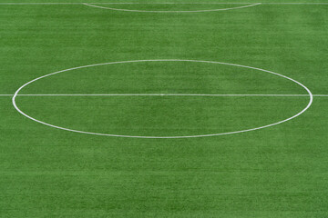 Close-up view of a white circular marking on a lush green soccer field, Trogir, Croatia