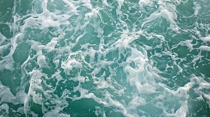 Fototapeta premium Aerial View of Jet Skis Creating Patterns on Turquoise Ocean Water with Swirling White Foam Trails for a Dynamic and Vibrant Experience