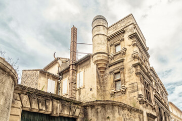 beautiful building with Historic architecture and blue clowdy sky in summer, Arles, France
