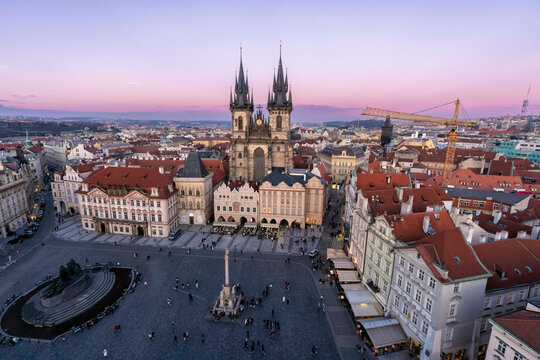 Aerial view of the Old Town Square with the Gothic Church of Our Lady before T&yacute;n at sunset in Prague, Czech Republic. 
