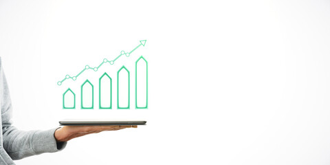 Hand holding tablet with a glowing graph of rising bars and arrow, on a white background. Concept of growth, success, and technology.