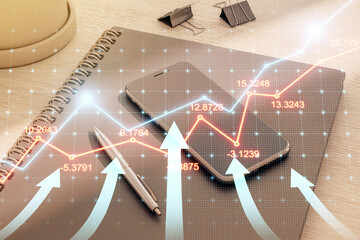 Digital financial growth chart overlay on notebook, pen, and smartphone on wooden desk background.