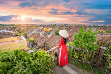 Vietnamese women in national costumes and daily life of villagers with tourists in Hoi An Ancient...