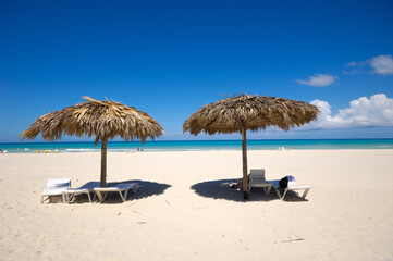 Beach with parasols and sunbeds