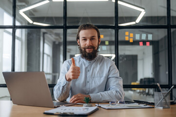 Fototapeta premium Feeling good, positive. Businessman is working in the office