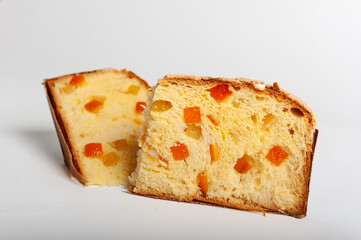 Slice of Panettone fruit cake with diced fruit pieces