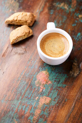 Cup of coffee and Cantuccini (Italian cookie) on dark wooden background. Copy space.