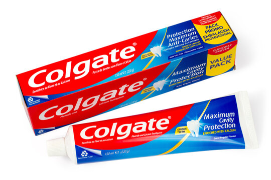Lychkovo, Dnepropetrovsk region, Ukraine - January 13, 2025: Box and tube of Colgate toothpaste on a white background. Cost-effective toothpaste packaging.