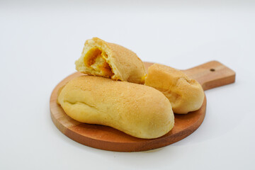 bread on a wooden cutting board. isolated background