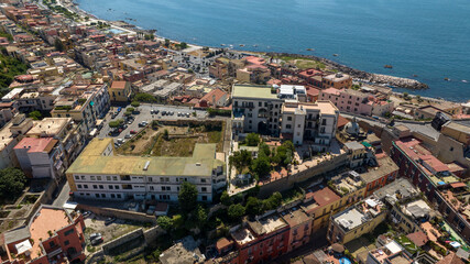 Naklejka premium Aerial view of houses, apartments and buildings in Pozzuoli, near Naples, Italy.