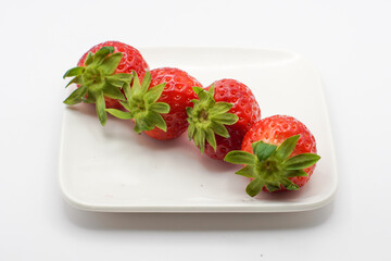 strawberries on a white plate