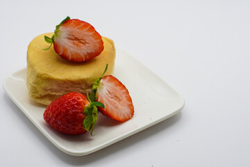 bread with strawberries on a white plate