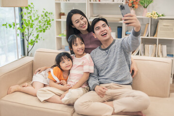 Young Asian family at home