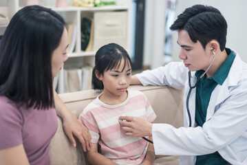 Fototapeta premium Asian mother and daughter at home, home doctor concept