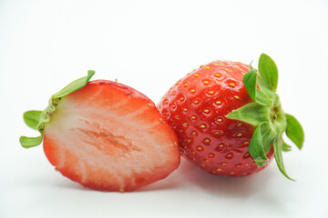 Red ripe strawberry fruits on a white background