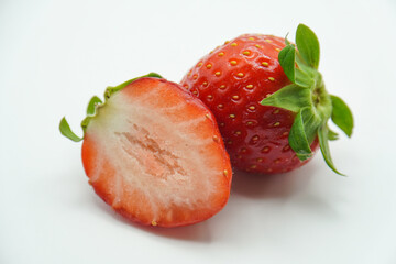 Red ripe strawberry fruits on a white background