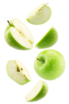 falling green apple with slices isolated on a white background