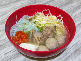 Bakso. Bakso is a very popular food in Indonesia, can be served with tofu and beef bones. Bakso is made from minced beef or chicken mixed with tapioca flour, garlic, and other ingredients.