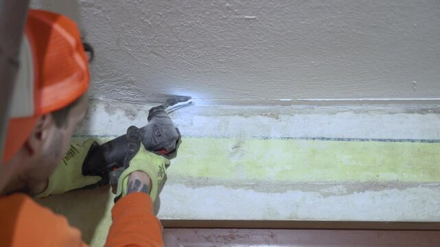 Contractor using oscillation tool multi tool for cutting
