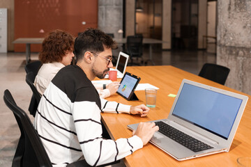 Coworkers focused on teamwork and productivity in an office setting
