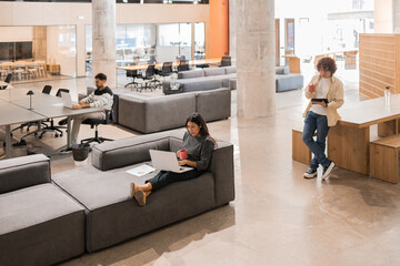 Modern open workspace with diverse professionals working