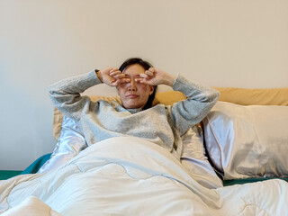 woman wake up on the green bed