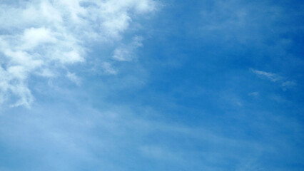 Blue and clear sky landscape with clouds.